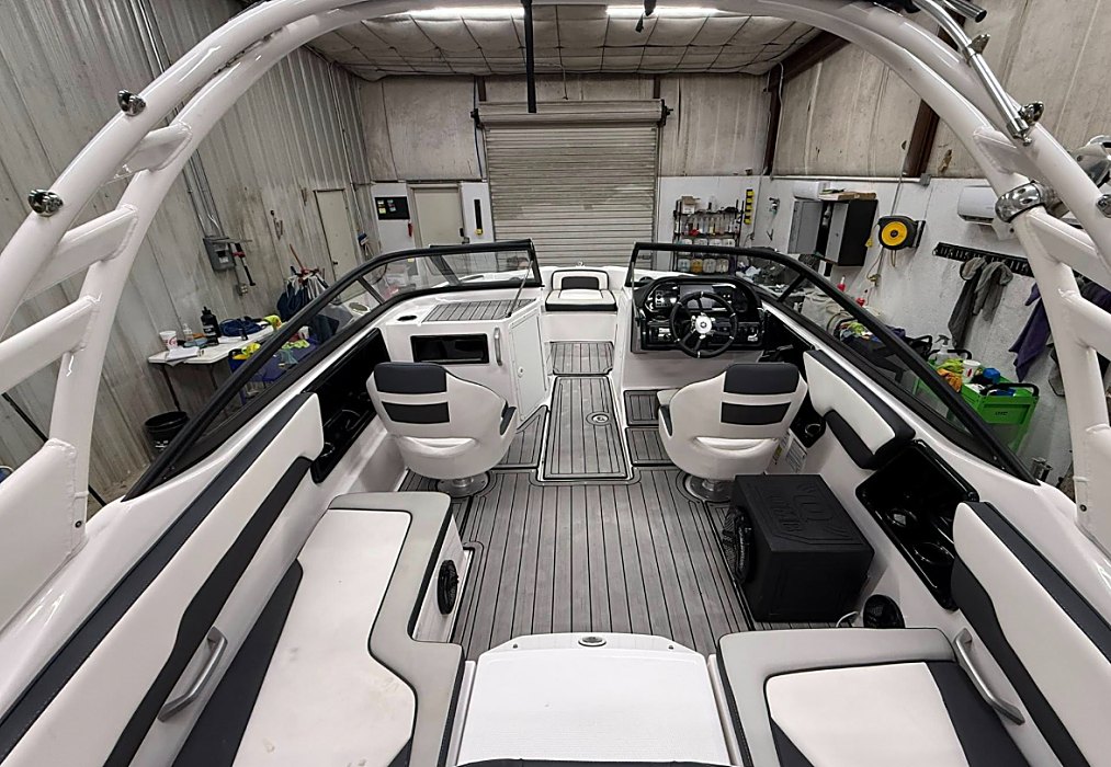 A restored boat interior with new teak-style flooring